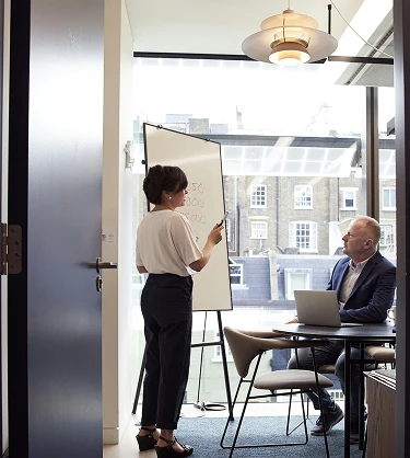 Image of two people on business meeting