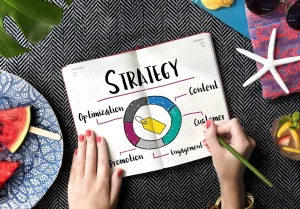 A photo showing an open notebook with a strategy written out.